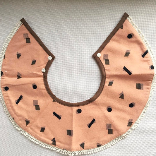 Banker Momma Dressy Bib - Peach Geo